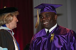 Anthony Carthon of Raeford received his bachelor's of science in nursing and was commissioned in the U.S. Army Nurse Corps. He is congratulated by Dr. Sylvia Brown, left, acting dean of the College of Nursing.