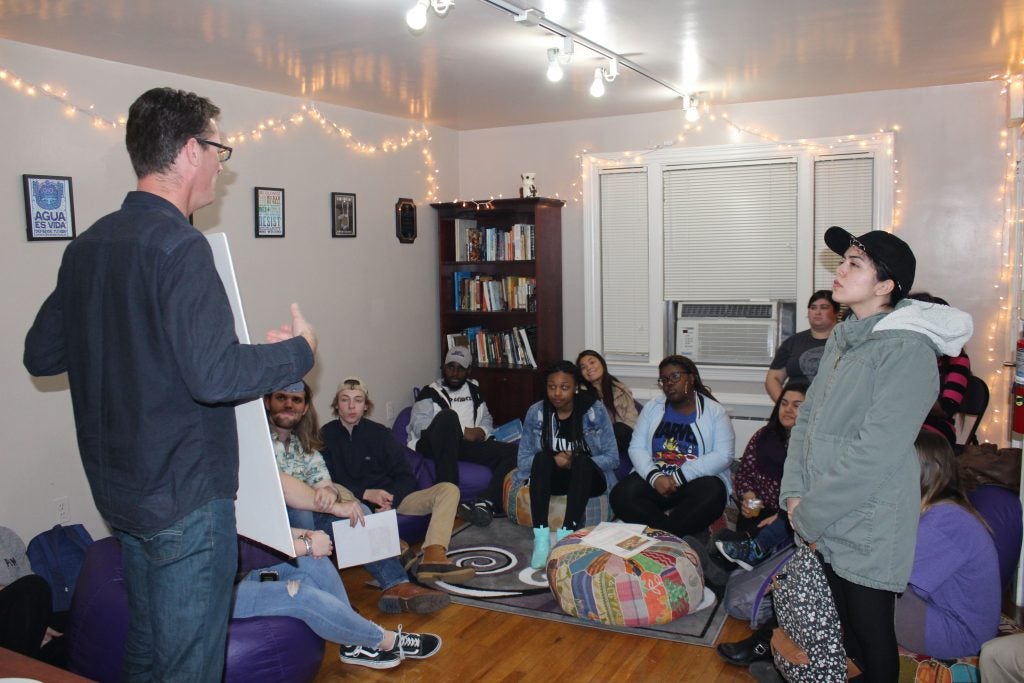 Dr. Nicholas Médevielle (left) discusses the significance and history of the French holiday, la Chandeleur