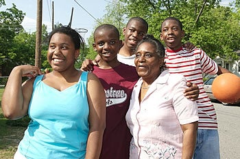 From left, Acolia Conley, Emmanuel Conley, Elijah Conley, Geri Walters and Quawshawn Conley take a break for a family photo. Photo by Cliff Hollis