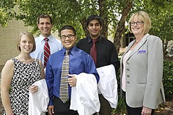 From left, Brody Scholars Mary Windham, Wesley O'Neal, Bryan Howington and Nabeel Arastu are among the 76 students who began medical school at ECU this week. Shown with them is Carole Novick, president of the ECU Medical & Health Sciences Foundation.