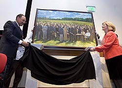 Dr. Paul Cunningham, dean of the Brody School of Medicine, and Dr. Phyllis Horns, interim vice chancellor for health sciences, unveiled a painting of 41 people who helped bring a medical school to ECU during the 2008 Brody fall convocation. Photo by Cliff