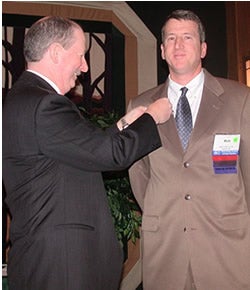 Dr. Mott Blair gets "pinned" during a ceremony to induct him as president of the N.C. Academy of Family Physicians. Contributed photo