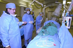 Dr. Joseph Babb, left, an ECU cardiologist, prepares to perform cardiac angioplasty using radiation to open a patient's narrowed artery at Pitt County Memorial Hospital's Heart Center. Such advanced technology helped land PCMH on a list of the nation's 50