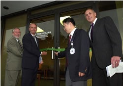 t the Oct. 9 ribbon-cutting ceremony and open house at the gastroenterology clinic were, from left to right, Greenville City Council member Ric Miller; Don Mills, chairman of the Greenville-Pitt County Chamber of Commerce; Dr. Jianjun Li 