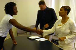 Latayvia Manning, left, a D.H. Conley High School student, hones her skills during a mock interview session held July 7 in Mendenhall Student Center at East Carolina University.