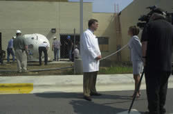 Dr. Marcus Randall is interviewed by WNCT Channel 9 reporter Laura Barron as a crew rolls the Leo W. Jenkins Cancer Center's Gamma Knife radiation unit into its new home on the medical campus. Photo by Doug Boyd