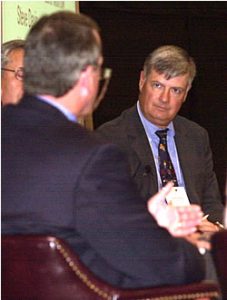 Dr. Charles Willson, right, listens as Dr. Mott Blair makes a point during a recent health care forum in Greenville. Willson, an ECU clinical professor of pediatrics, is the new president of the N.C. Medical Society. Photo by Doug Boyd