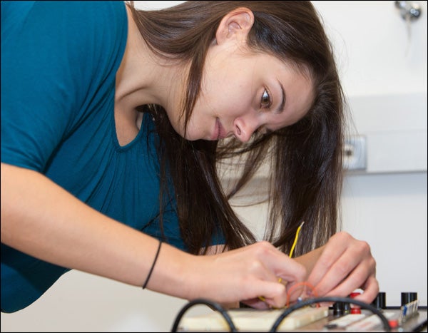 ECU engineering student Barbara Sage is shown installing components for a single channel EKG heart metering device she is building in her class. 