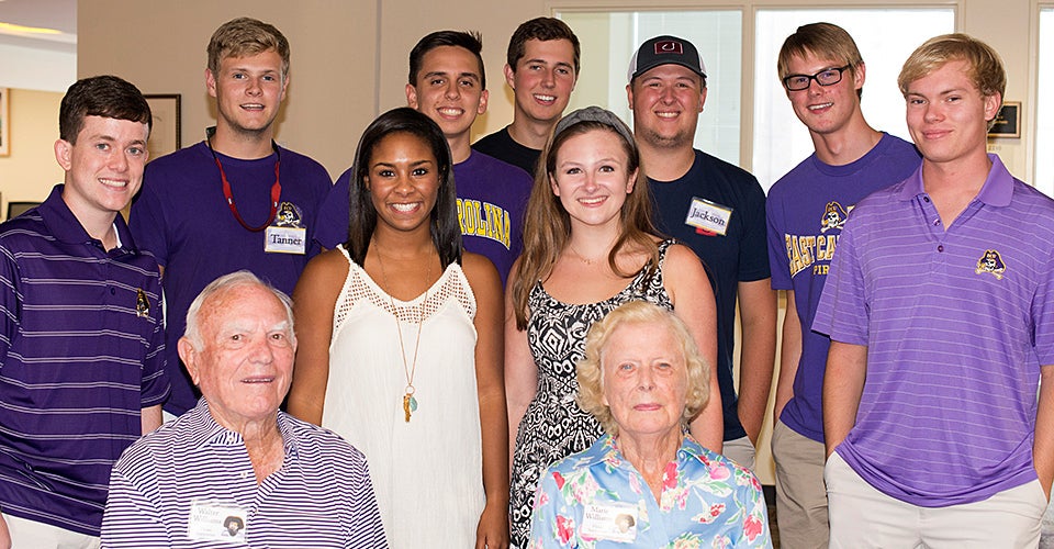 The newest STEPP cohort poses for a picture with donors Walter and Marie Williams. (Contributed photos by College STAR)
