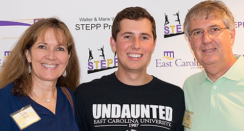 Andersen Ward (middle) poses with his mother, Lisa, and father, Craig, during the STEPP Program’s red carpet welcome dinner.