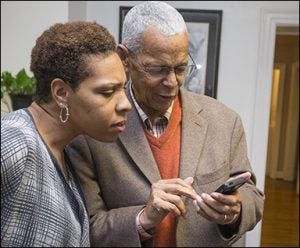 Melissa Haithcox-Dennis, director of ECU's Ledonia Wright Cultural Center, enjoys a moment with Julian Bond.