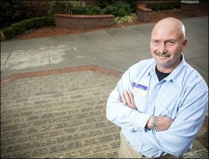 ECU brick mason Ron Causey, a U.S. Army veteran, helped to lay the bricks honoring military service in the ECU Memorial Walk.