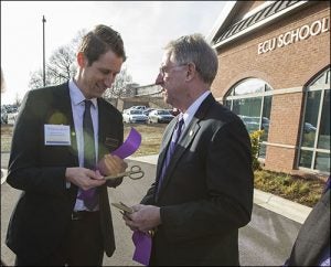 Dr. Ryan Cook, faculty at the Davidson County center, left, and Dr. Greg Chadwick, dean of the ECU School of Dental Medicine, prepare for the ribbon cutting ceremony Dec. 15.