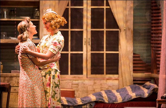 Sisters Stella Kowalski, left, and Blanche Dubois greet each other when Blanche arrives in New Orleans.