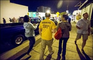 Student researchers arrive in the downtown Greenville area to seek volunteers who will participate in the data collection.