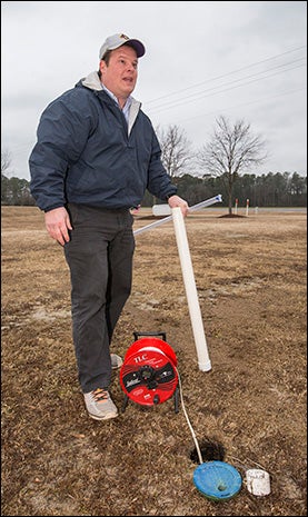 ECU geologist Mike O’Driscoll checks water for contaminants.