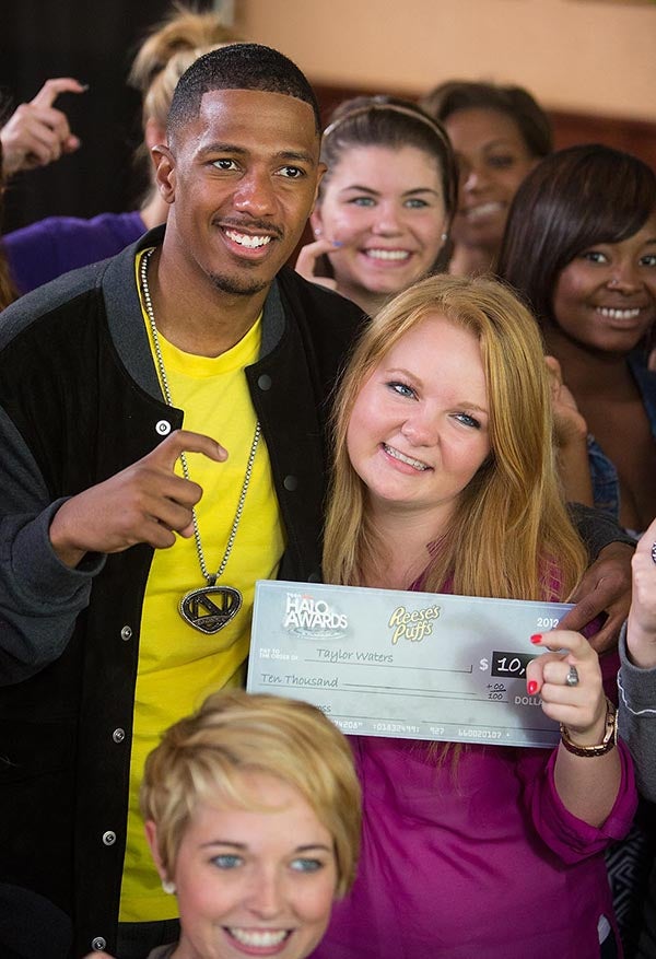 Actor and TV personality Nick Cannon poses with ECU sophomore Taylor Waters after presenting her with the TeenNick HALO Award, given annually to young adults across the country for service and leadership. The honor comes with a $10,000 prize to go toward her cause - disaster relief through the American Red Cross. 