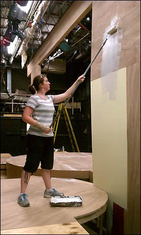 Mandy Goynes, an ECU student interning in Ohio, begins the base coat of paint for the portals on the set of "Bye, Bye Birdie." She is working for the Findlay Summerstock Theatre Program. (Contributed photo)