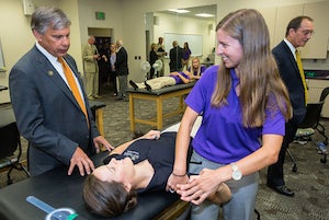 UNCP Chancellor-Elect Robin Cummings interacts with second-year physical therapy students at ECU.