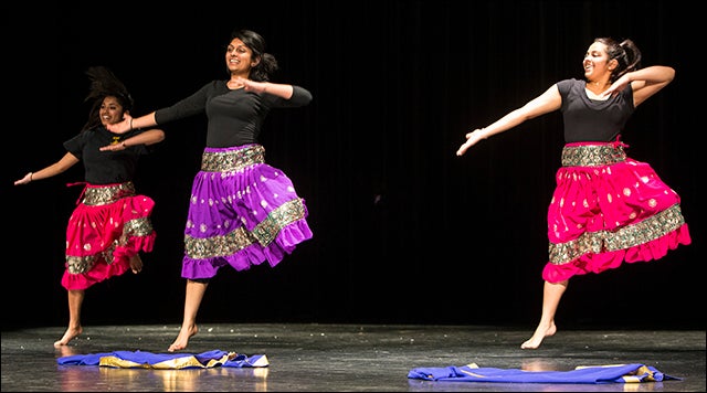 The Arrya Pirates group practices their dance routine on stage.