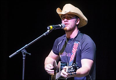 ECU accounting major Joshua Branch practices his country music performance for the Down East Talent competition.