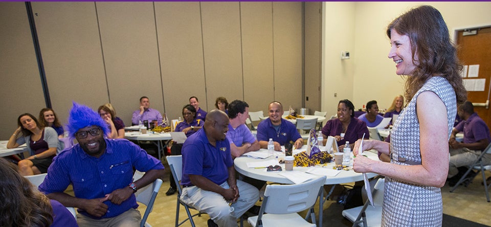 Pictured below, Hopkins works with ECU admissions staff to enhance communication skills.