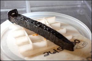 A nail from Queen Anne's Revenge awaits transport to the N.C. Maritime Museum in Beaufort.