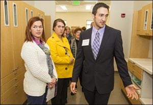 Fourth-year student Kyle Duncan, right, gives a tour of the new Spruce Pine facility.