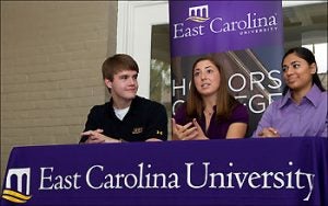 Honors College students Matt Edwards, Taylor Lawless and Shayna Mooney, left to right, speak during a back-to-school media event on campus. (Photo by Cliff Hollis)