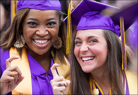 Newly minted ECU alumni show their Pirate pride at the 2015 commencement ceremony.