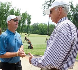 Former ECU head football coach Skip Holtz and athletic director Terry Holland enjoy the day. Photo by Cliff Hollis, ECU News Services.