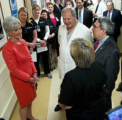 U.S. Health and Human Services Secretary Kathleen Sebelius talks with Dr. W. Randolph Chitwood Jr. and U.S. Rep. G.K. Butterfield during a tour of the East Carolina Heart Institute at Pitt County Memorial Hospital Monday, May 23. Photos by Cliff Hollis