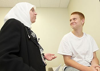 Dr. Baseema Dibas talks with Dakota Widdows, 15, who received a new kidney last month. Photo by Cliff Hollis