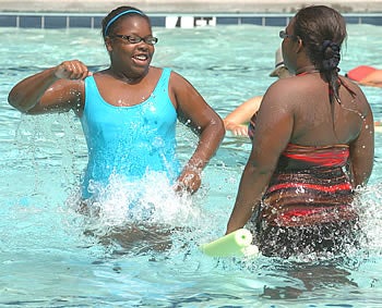 Campers splash in the pool at last year's Take Off 4-Health camp near Columbia. Photo by Doug Boyd