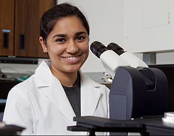 Shayna Mooney has been studying cardiac muscle in the physiology lab of Dr. David Tulis. Photo by Cliff Hollis