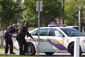 ECU police officers participate in an emergency drill Tuesday, Aug. 2, at the Health Sciences Building. Photo by Cliff Hollis