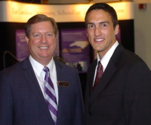 Dr. James R. Hupp, left, dean of the ECU School of Dental Medicine, poses with Kyle Duncan, the first recipient of the Samuel L. Phillips Family Foundation Scholarship. Photo by Doug Boyd