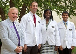 From left to right, Mickey Dowdy, ECU's vice chancellor for university advancement and interim president of the ECU Medical & Health Sciences Foundation, is pictured with Brody Scholars Scott Gremillion of Raleigh, Marlana Sheridan of Roanoke Rapids and Sunny Darji of Charlotte. Photo by Cliff Hollis, ECU News Services.