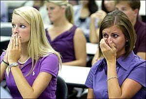 ECU dental students Christin Carter, left, and Shannon Holcomb listen during the Tuesday, Aug. 16, news conference. Photos by Cliff Hollis