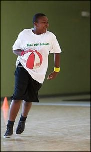 Keyante Mitchell, 14, of Grifton enjoys a game of pick-up basketball at Take Off 4-Health on Aug. 9. Photos by Cliff Hollis