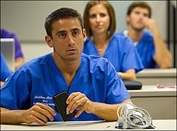 Student Matthew Marrone listens during a lecture on the first day of classes at the ECU School of Dental Medicine. Photos by Cliff Hollis