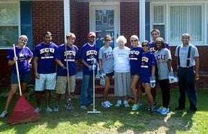 ECU dental students, from left, Rebecca Ferguson, Haseeb Rauf, Mark Dobransky, Nirav Patel, Shannon Holcomb, Christin Carter, Reeva Sawhney, Matt Morrone, Bridgette Jones and Barry Price pose with Greenville resident "Ms. Doris" after the students worked in her yard Monday, Aug. 29. Contributed photo