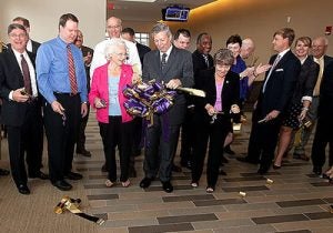 ECU Chancellor Steve Ballard, center, flanked by N.C. Reps. Edith Warren, left, and Marian McLawhorn, right help cut the ribbon at the new ECU Family Medicine Center on Friday, Sept. 23. Photos by Cliff Hollis