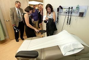 Janice Paris, center, demonstrates exam room features in the new ECU Family Medicine Center on Friday, Sept. 23.