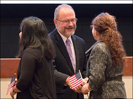 ECU Provost Ron Mitchelson congratulates new U.S. citizens at the end of the ceremony.