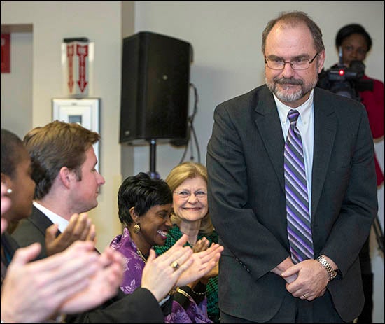 Newly appointed Provost Ron Mitchelson stands to receive congratulations from the audience at the Board of Trustees meeting Feb. 20. (Photo by Cliff Hollis)