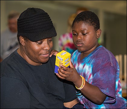 Sherinetta Smith, left, and her son Marvin spend time together at Camp Needles in the Pines. Smith attended the camp herself when she was a teenager.