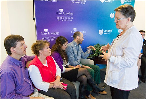 Registered nurse Karen Chamberlain, who helped keep the swap and transplant process on track, speaks with the families of donors and recipients.