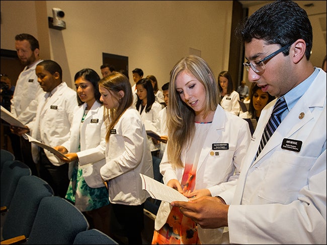 Incoming Brody medical students recite the Medical Student Pledge of Ethics during the ceremony.