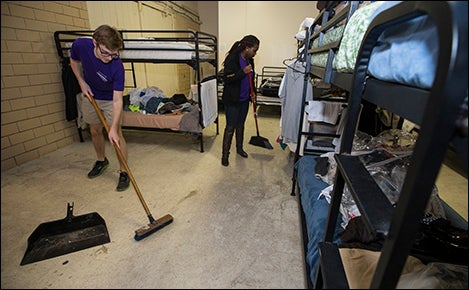 Josh Jackson, left, and Khiana Wyatt clean the floor during their "Staycation" in Greenville.